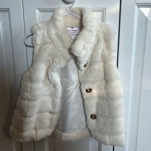 White fur vest